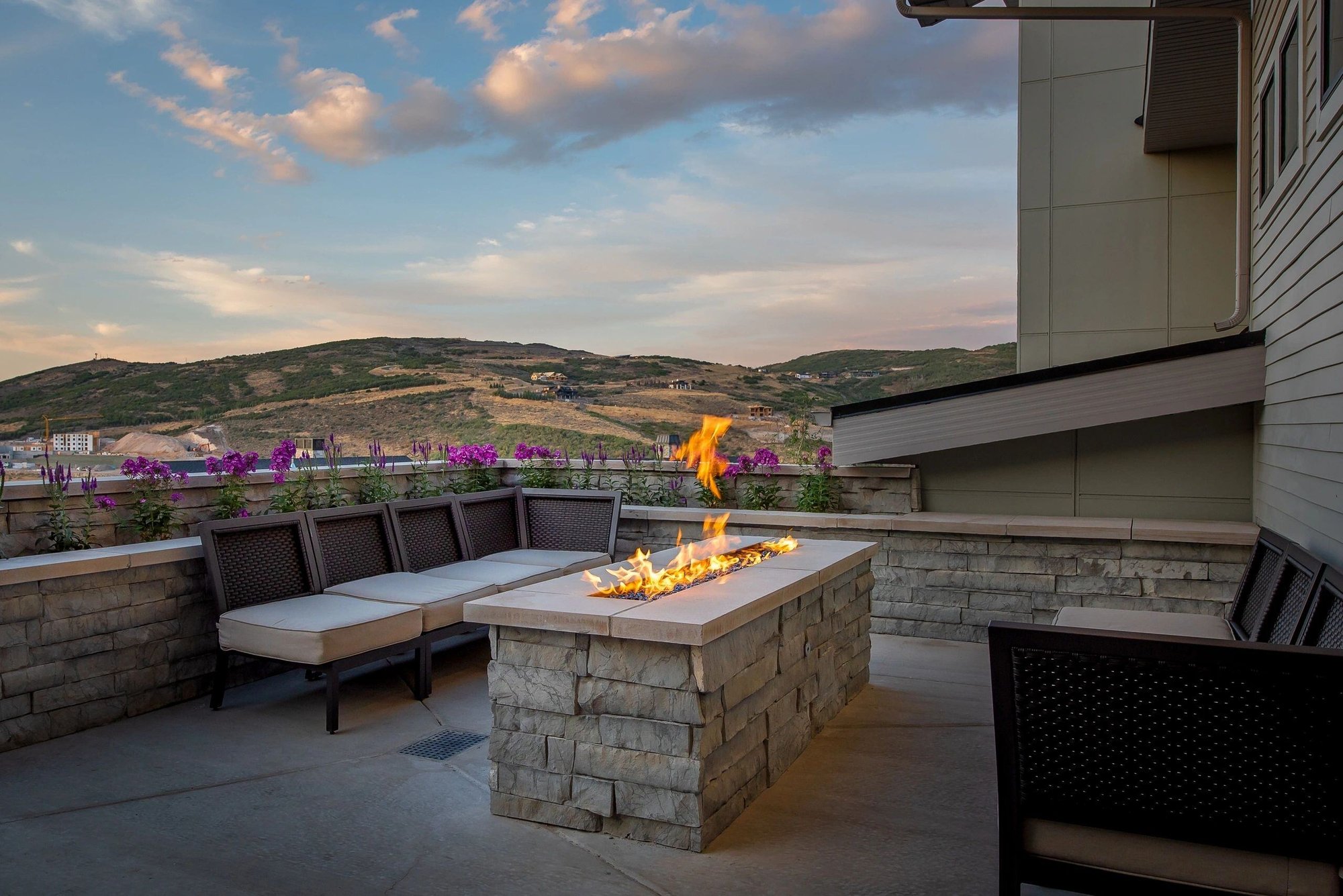 patio view with built-in fireplace Heber city custom home by E Builders 