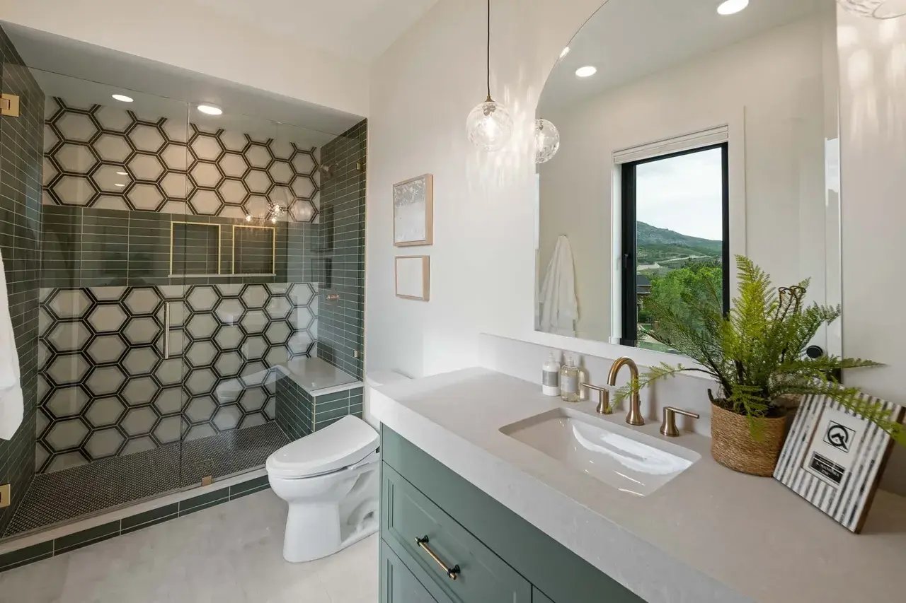 A custom bathroom featuring a walk-in shower by E Builders in Utah