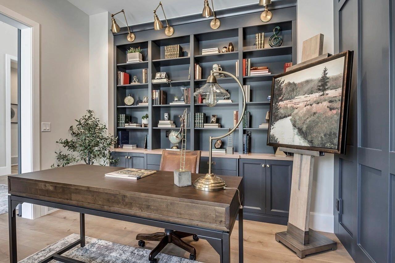 Built-in bookcase featured in a home office in a custom home by E Builders featured in the 2019 Utah Valley Parade of Homes