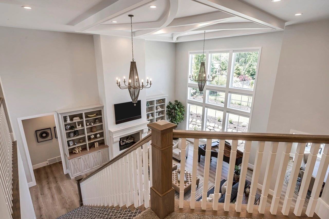 Coffered ceiling and open concept living in a custom home by E Builders featured in the 2019 Utah Valley Parade of Homes