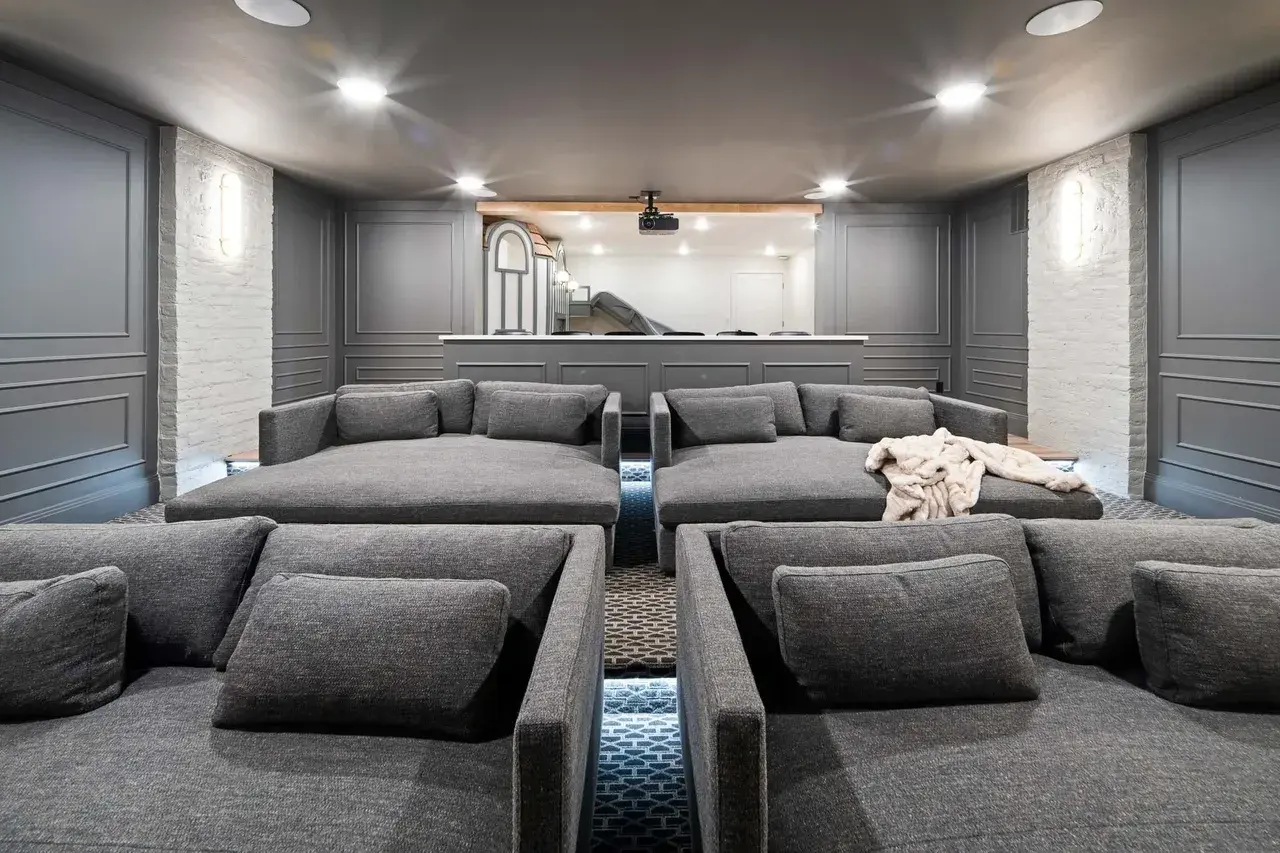 Modern basement theater room in a custom home in Utah Valley by E Builders