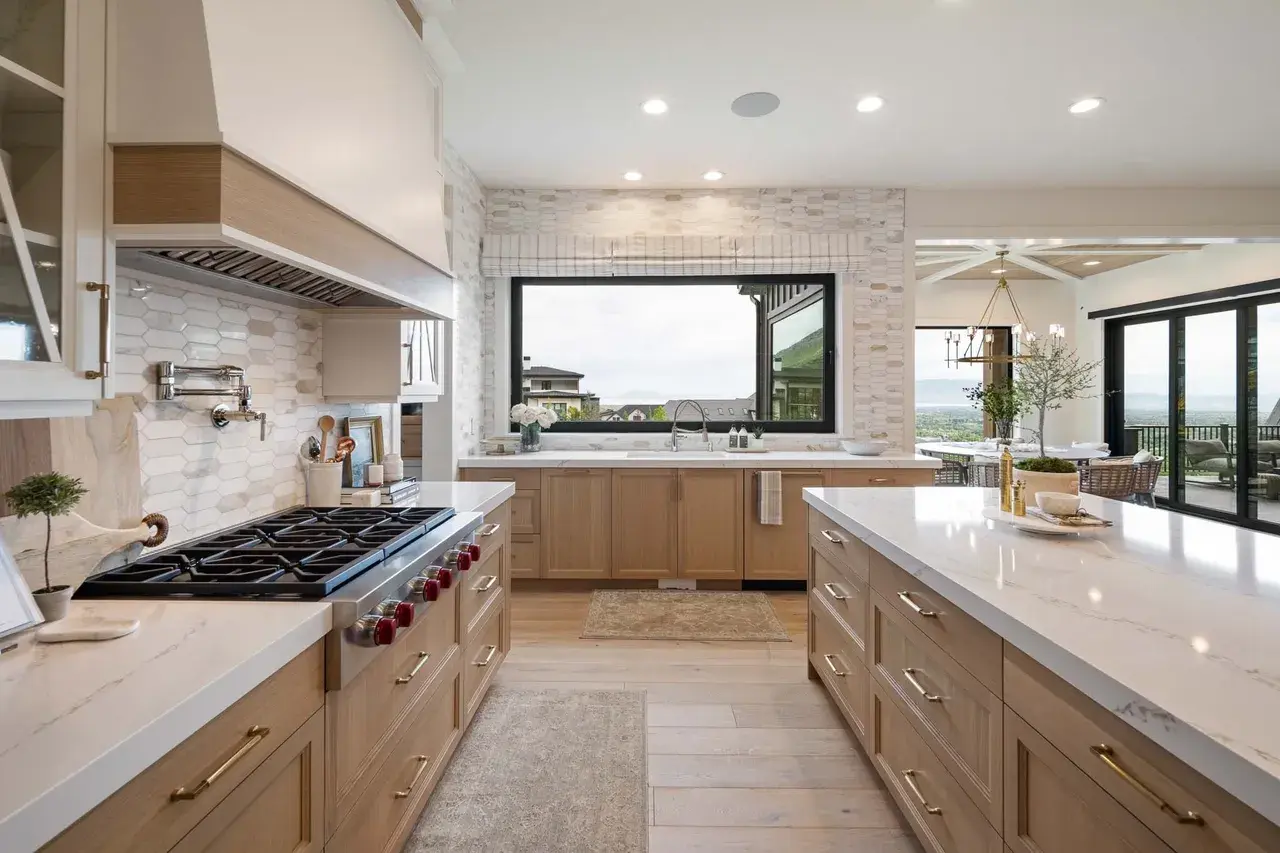 Modern kitchen design with scenic views in a custom home in Utah Valley by E Builders