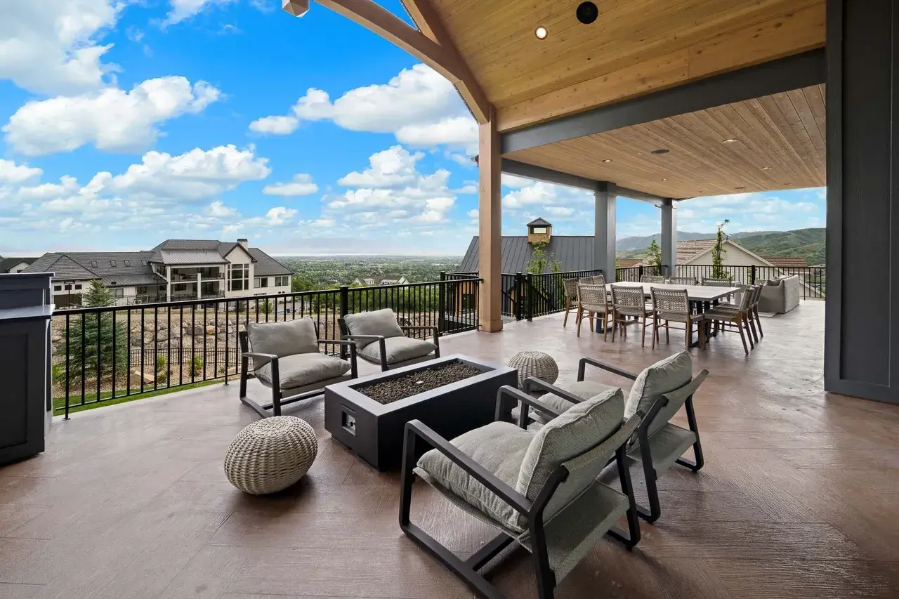 Mountain-view deck with firepit in a custom home in Utah Valley by E Builders
