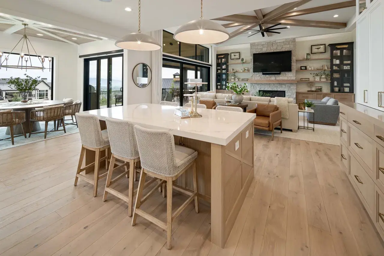 Spacious open-concept kitchen and living room in a custom home in Utah Valley by E Builders