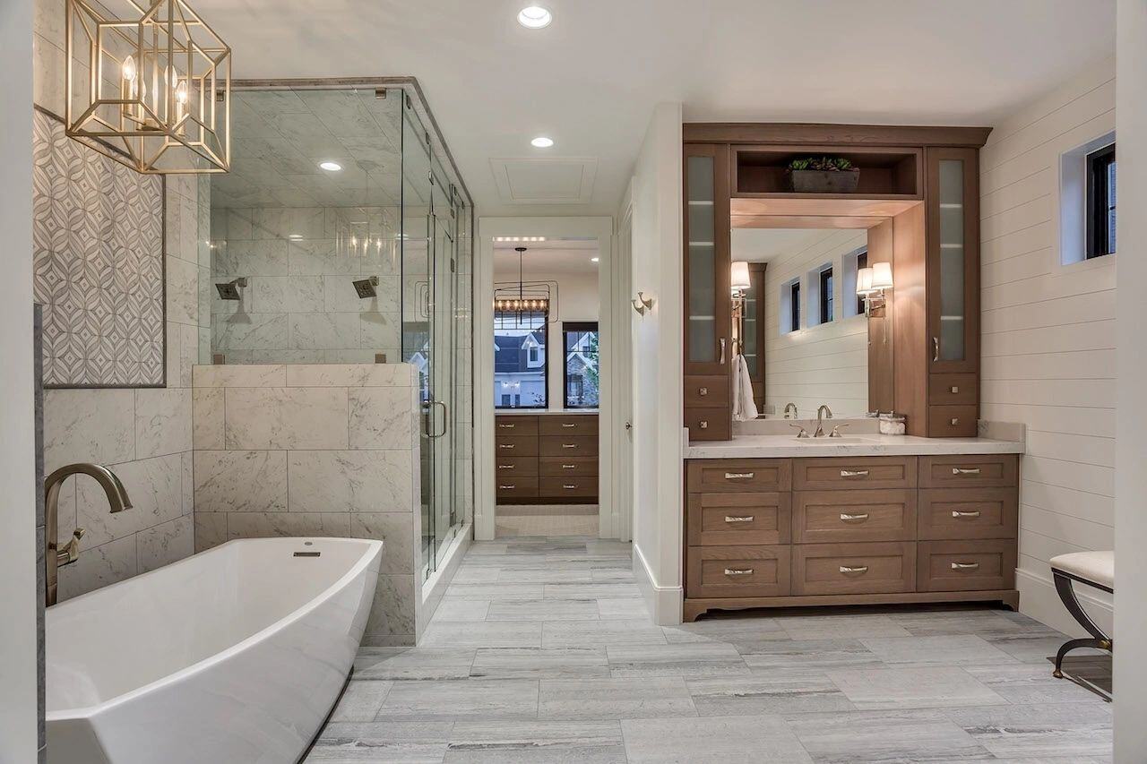 Custom bathroom vanity with double sinks and wood cabinetry in a custom home in Draper, UT by E Builders