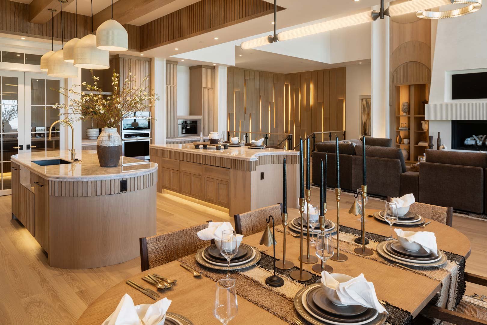 Light-filled dining space adjoining luxurious kitchen in custom home Room with a View featured in the 2025 Utah Valley Parade of Homes by E Builders