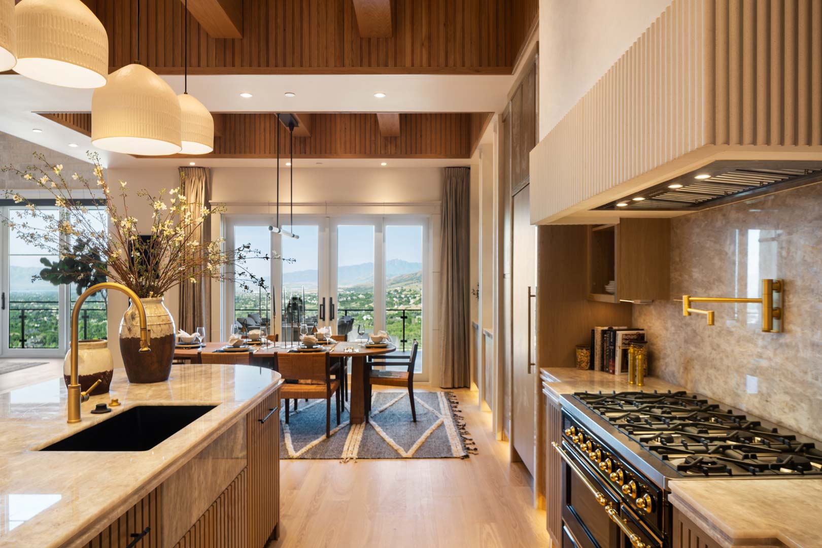 Luxury kitchen with chef-grade appliances and scenic views in custom home Room with a View featured in the 2025 Utah Valley Parade of Homes by E Builders