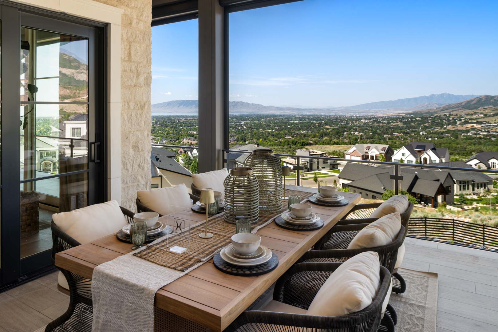 Outdoor dining table with valley overlook in custom home Room with a View featured in the 2025 Utah Valley Parade of Homes by E Builders