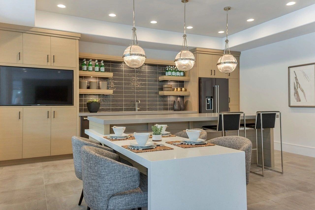 Cozy dining nook with bar seating and built-in entertainment center in a custom home in Salt Lake City, UT built by E Builders