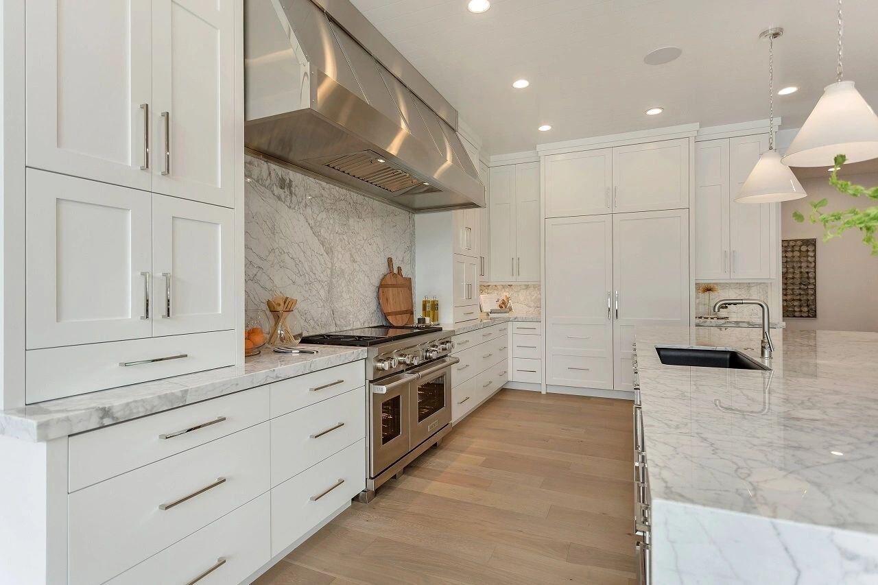 Luxury kitchen featuring dual ovens and sleek cabinetry in a custom home in Salt Lake City, UT built by E Builders