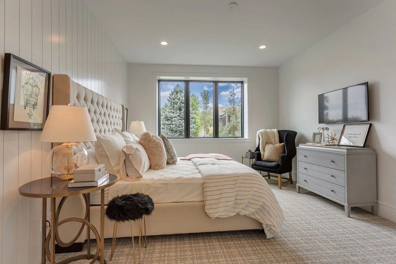 Serene guest suite with modern decor and soft lighting in a custom home in Salt Lake City, UT built by E Builders.