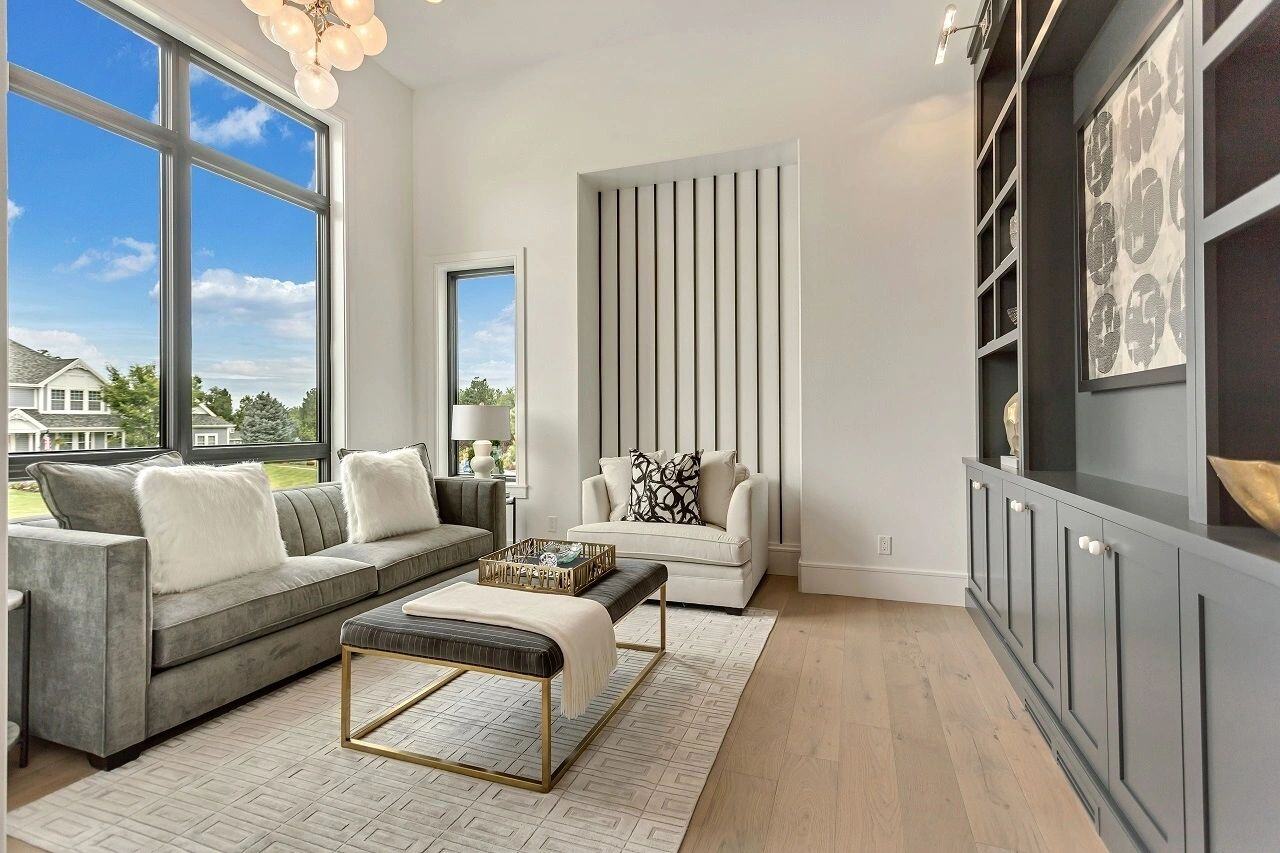 Sophisticated lounge area with designer lighting and natural light in a custom home in Salt Lake City, UT built by E Builders