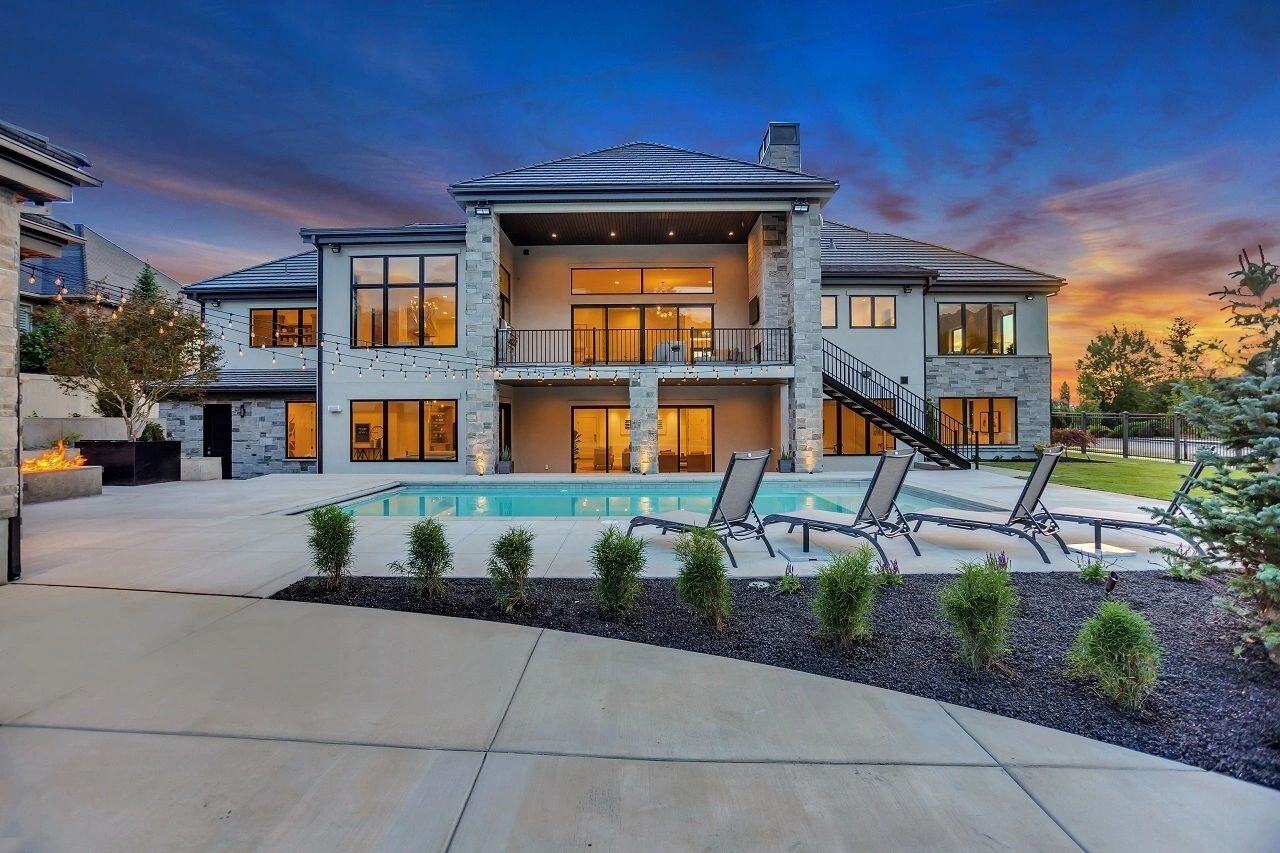 Two-story backyard elevation with modern pool in a custom home in Salt Lake City, UT built by E Builders
