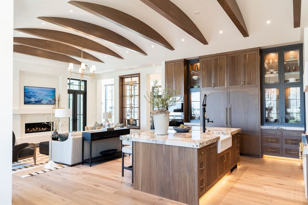 Custom kitchen view with fluted cabinetry and quartzite countertops in a custom home featured in the 2025 Utah Valley Parade of Homes