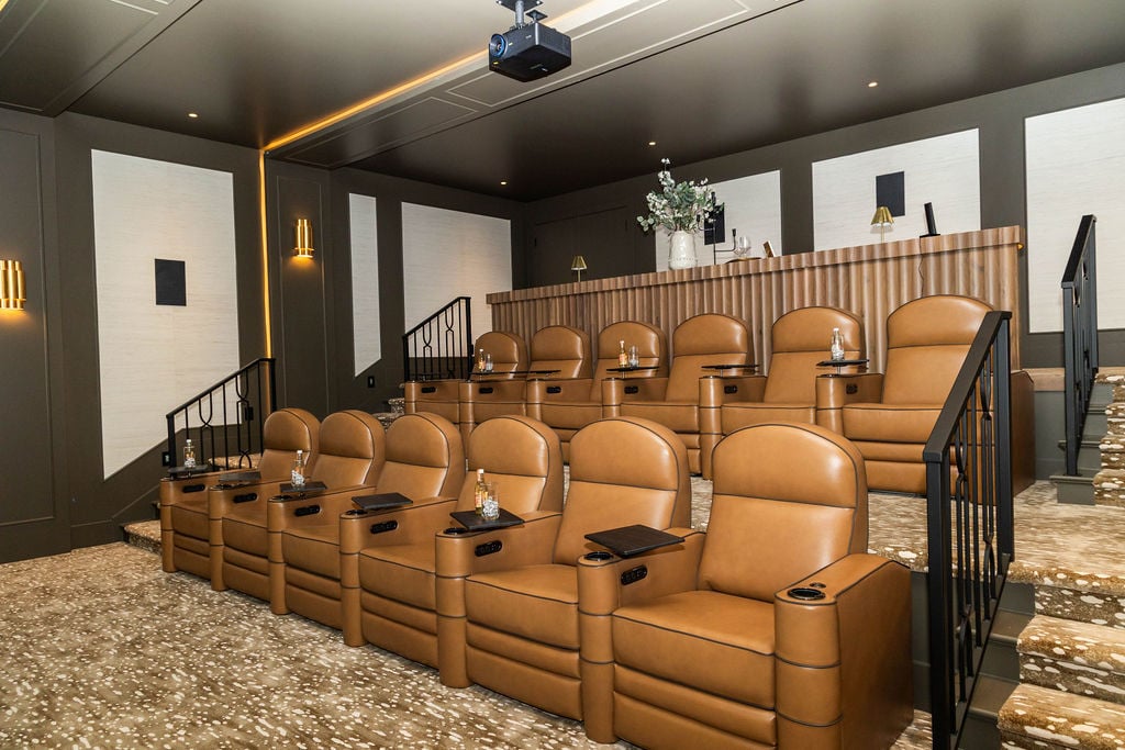 Plush leather recliners in a luxury theater room of a custom home featured in the 2025 Utah Valley Parade of Homes