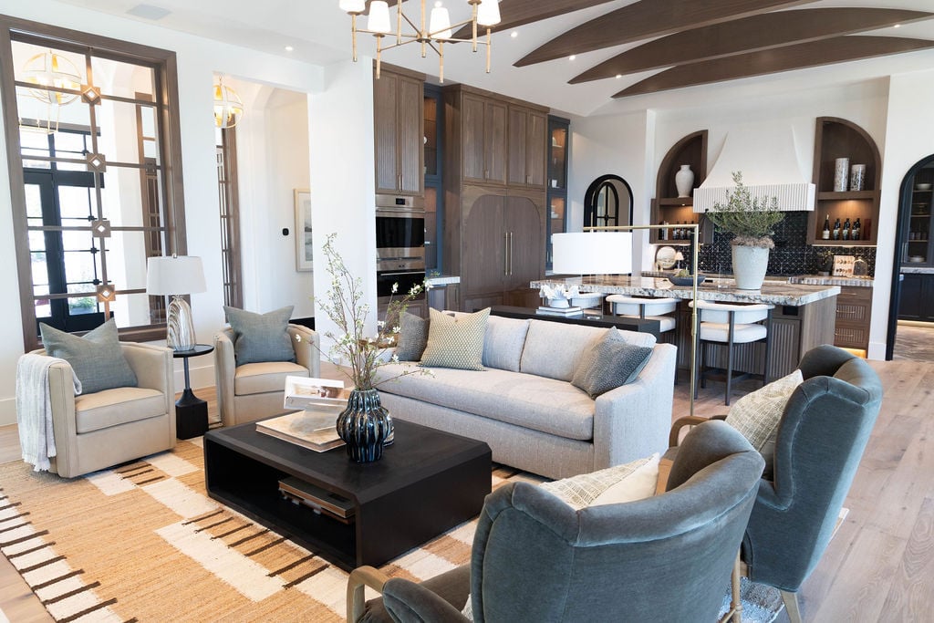 Spacious Utah Valley kitchen and living room with vaulted ceiling and modern finishes