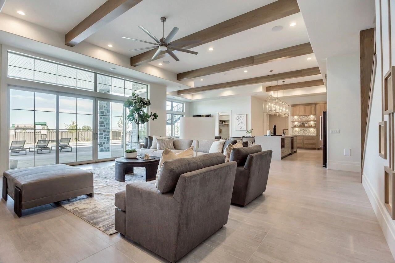 Basement open living area with modern furnishings in a custom home in Utah built by E Builders.