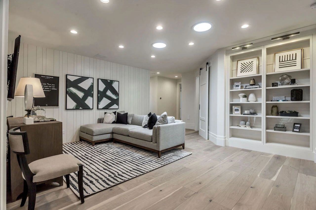 Cozy upstairs family room with built-in shelves in a custom home in Utah built by E Builders