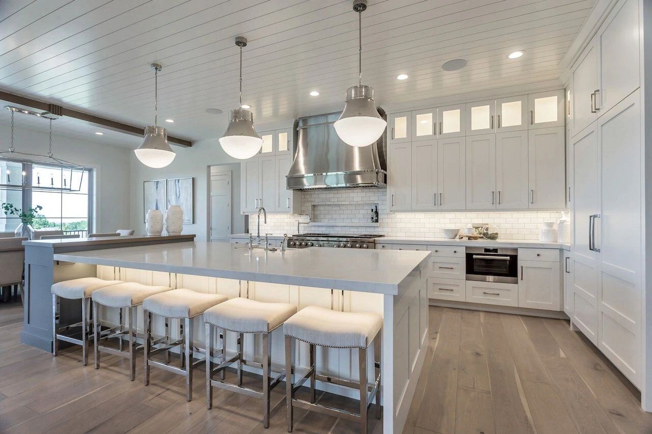 Elegant kitchen design with pendant lighting in a custom home in Utah built by E Builders
