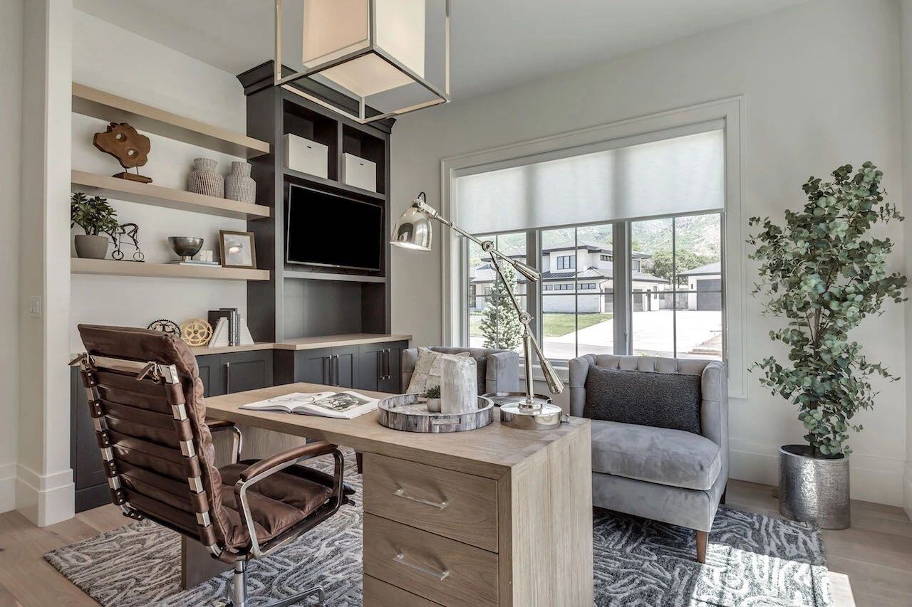 Home workspace with contemporary decor and greenery in a custom home in Utah built by E Builders
