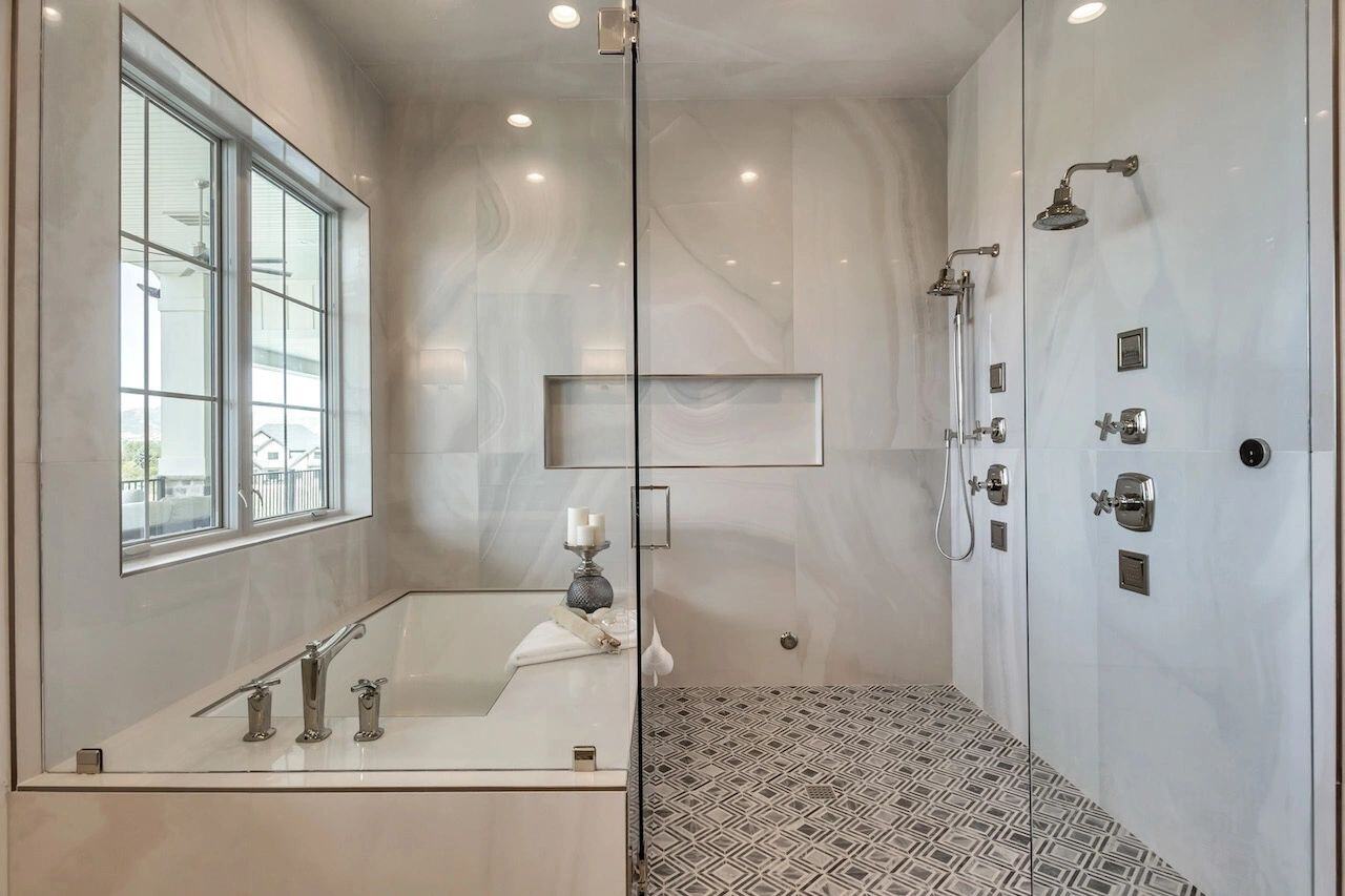 Luxury master bathroom with walk-in shower and soaking tub in a custom home in Utah built by E Builders